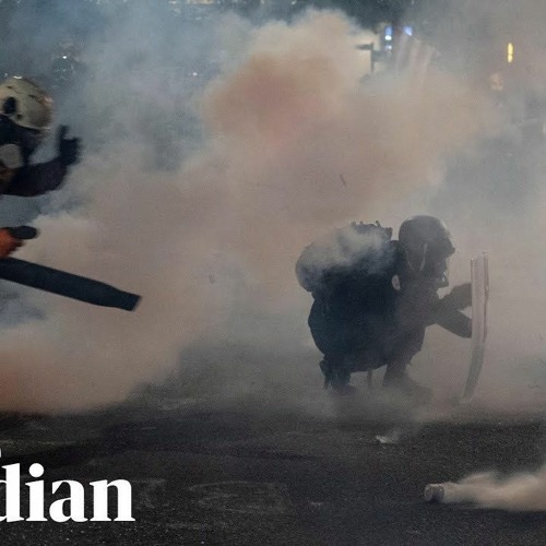 With Masks Upon Their Faces And Leaf-Blowers In Their Hands