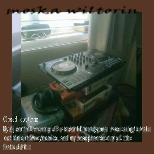 moska wiltorin - the DJ is doing things with the turnttables at live event with the sky turnin red