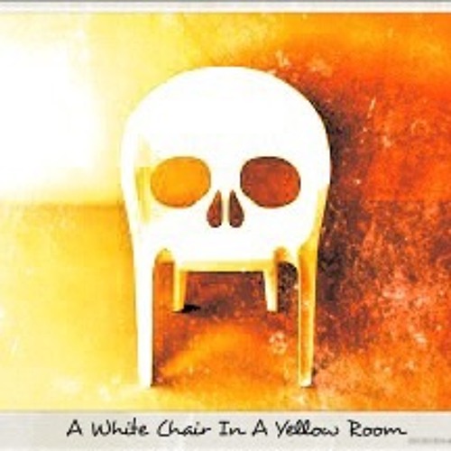 A White Chair In A Yellow Room