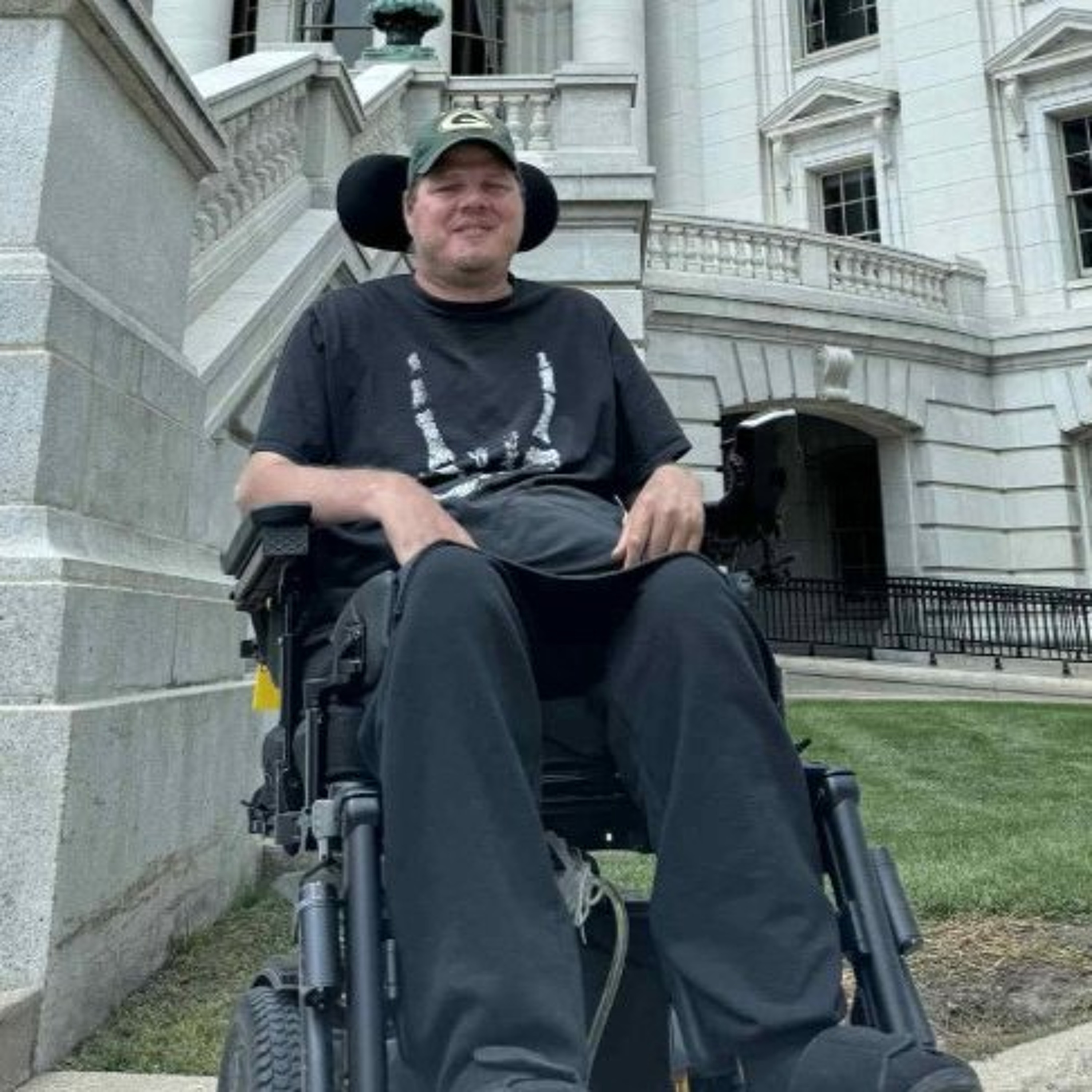 Disability advocate travels 125 miles by wheelchair to defend home care episode artwork
