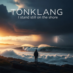 I stand still on the shore,