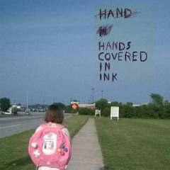 hands covered in ink