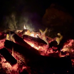 Light rain falling on a campfire