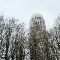Live from the building on the left, behind the tall one with square windows