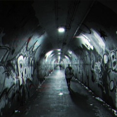 Punk Vandalizing Tunnel Wall