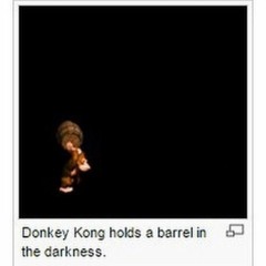 donkey kong holds a barrel in the darkness