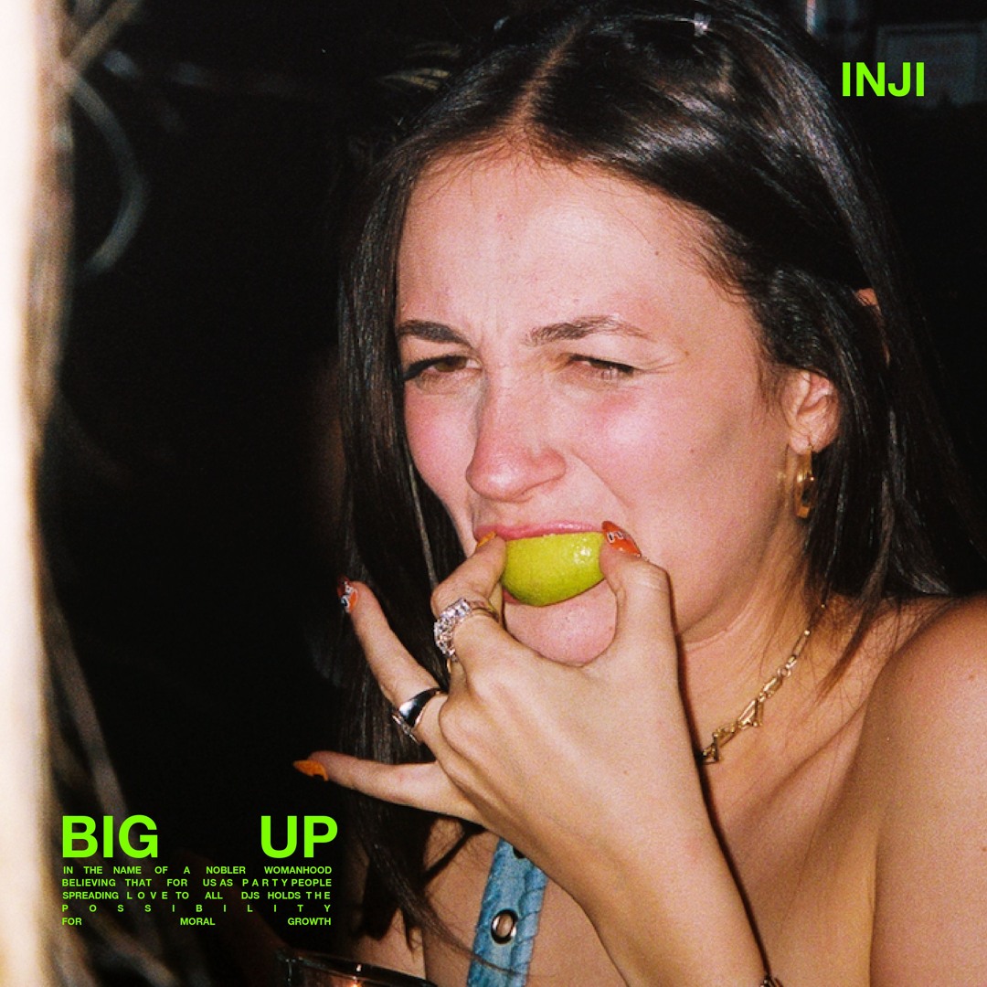 Album cover featuring a color photograph of a woman biting into a green apple against a dark background.