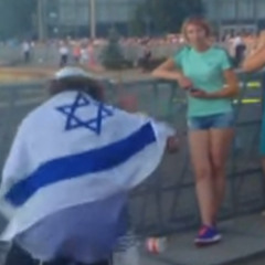 one hand on the dreidel