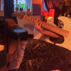 max plays the electric guitar