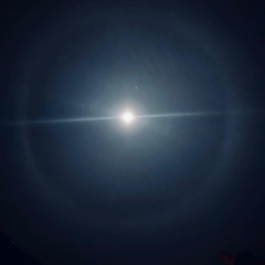 i looked up the sky the other night expecting to see darkness , but all i saw was a halo of silver.