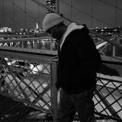 AT HIS FEET