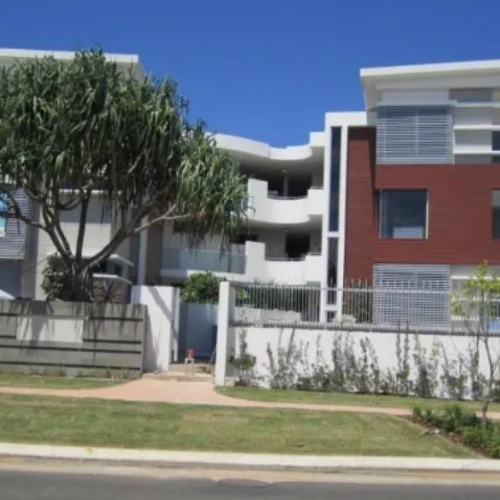 What role do building codes and regulations play in a practical completion inspection?