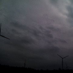 Windmills By The Ocean