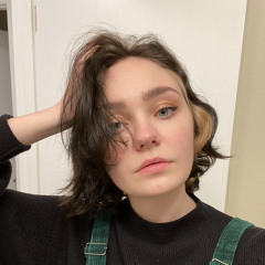 two peanuts and a sad green m&m