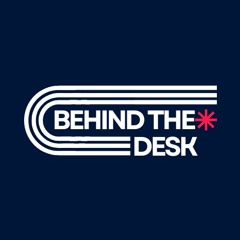 BEHIND THE DESK*